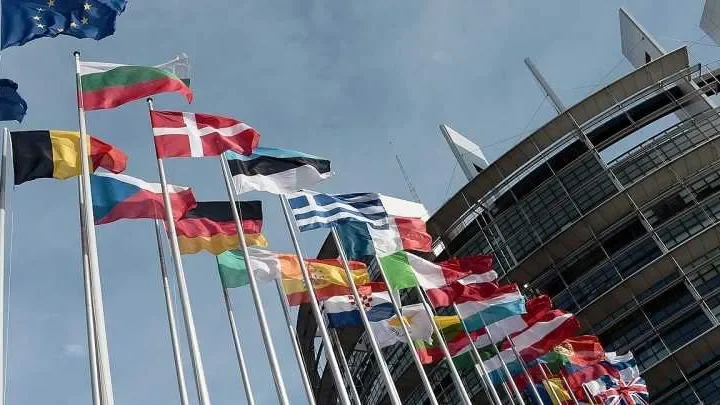 European Union officials discussing policies affecting financial membership benefits